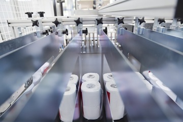 Paper products on a production line, representing hydraulic solutions for the paper mill industry