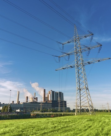 Power plant and transmission lines representing Hydraulic Supply Company's hydraulic solutions for the energy industry